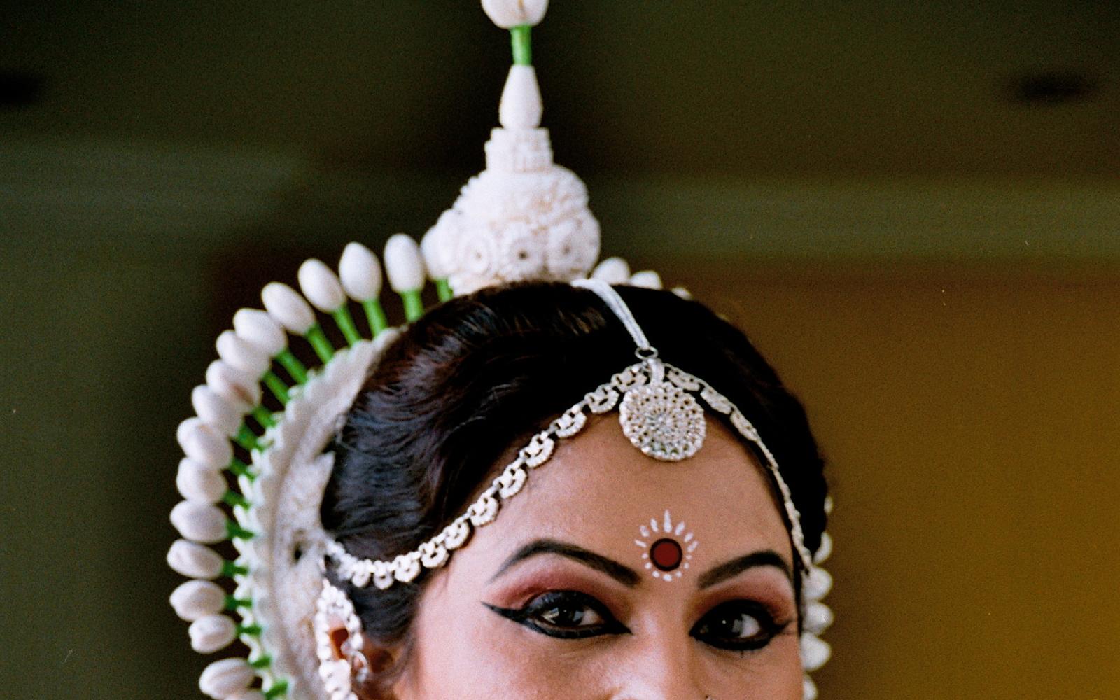 Shubhada Varadkar in Odissi headdress and silver jewellery, close portrait.