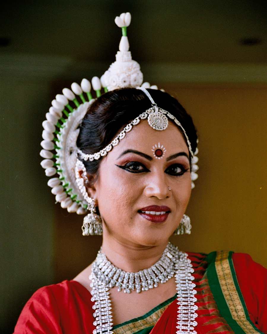 Shubhada Varadkar in Odissi headdress and silver jewellery, close portrait.